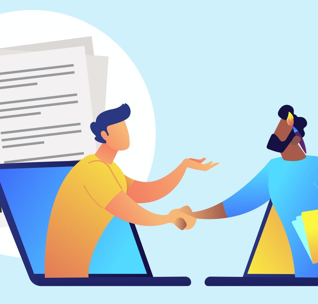 Two designers are discussing their work & shaking their hands.